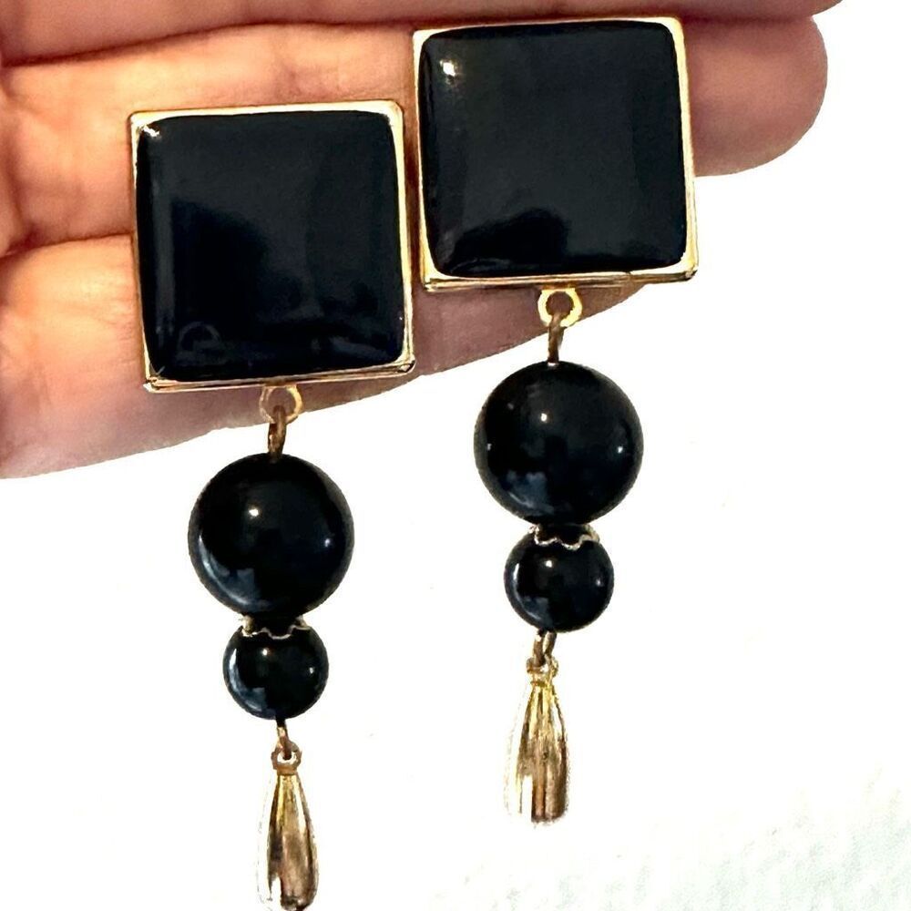 Black and gold tone drop earrings